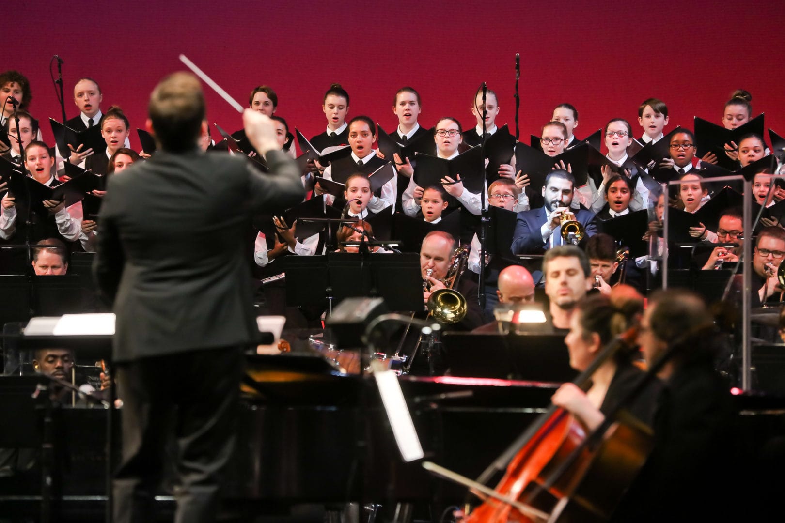 <h3>Michael Rossi conducts the orchestra, along with Ibrahim Maalouf (center-right) and the National Children’s Choir.</h3>
